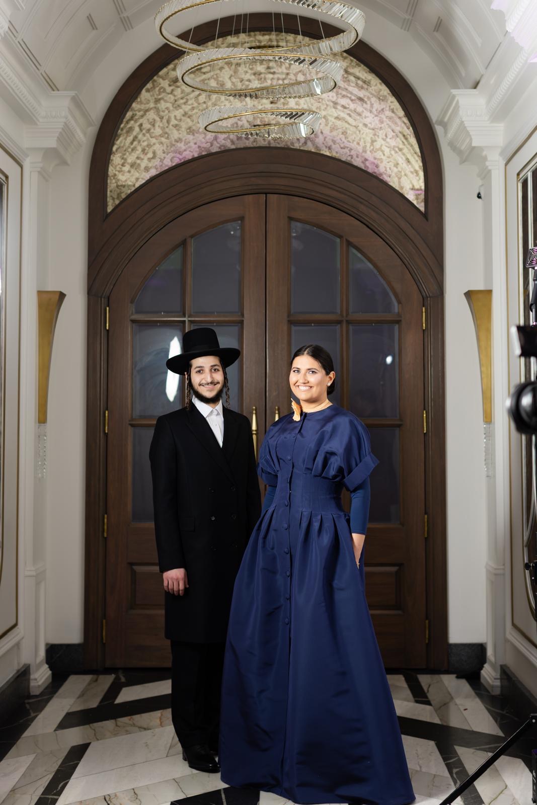 Frady and Moshe Elya under the archway